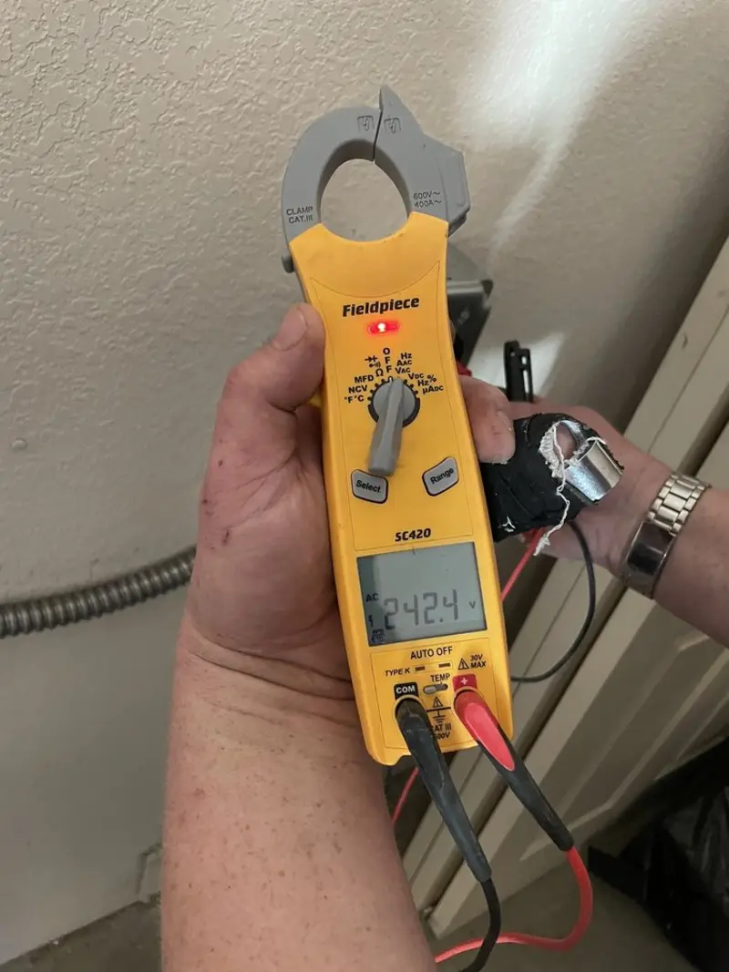 Voltage testing with clamp meter during Ceiling Fan Installation in Annapolis